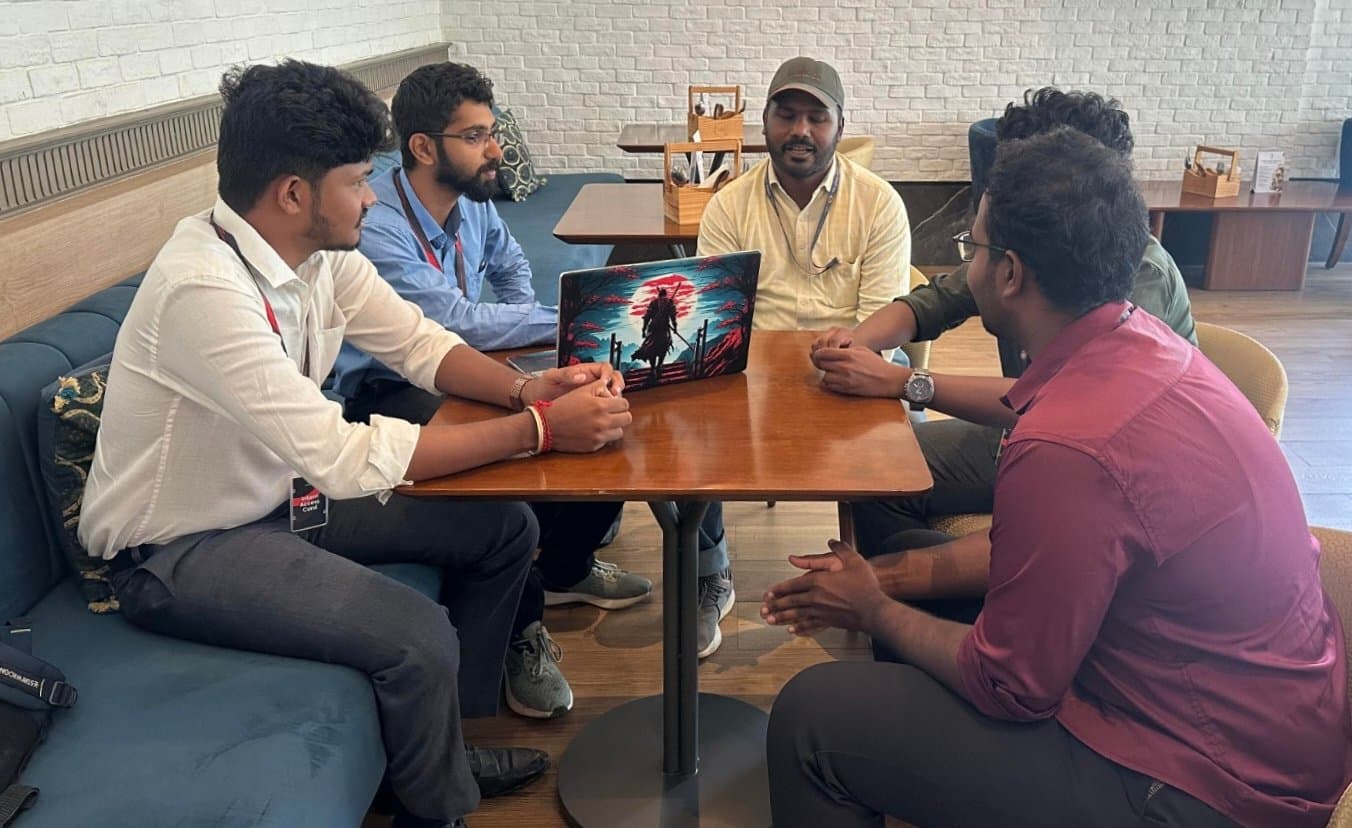 The LeakSonic team in discussion with GAIL Senior Manager Ashwin Kumar A. around a table, reviewing the Sentrix presentation